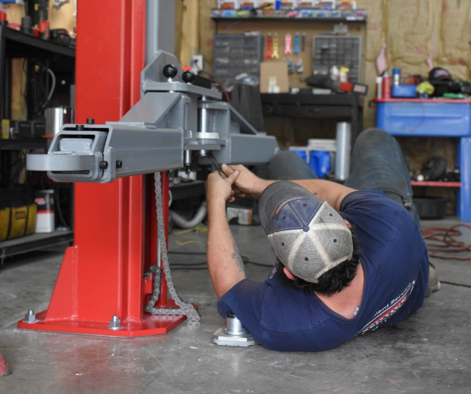 Technician working in the Automotive Lift Service garage